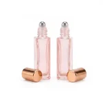 kemasan BOTOL ROLL ON 10 ML (DGPINKSPRY) varian warna pink transparan dengan gold cap