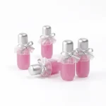 kemasan botol lip gloss ukuran kecil dengan dekorasi pita premium
