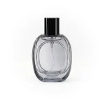 kemasan botol parfum GRASS BLACK TRANS varian warna abu abu transparan dengan cap hitam
