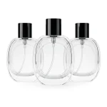 kemasan botol parfum GRASS TRANS varian warna transparan dengan cap hitam
