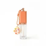 kemasan kosmetik BOTTLE LIP 097 varian warna bening transparan dengan aksen peach