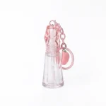 kemasan kosmetik BOTTLE LIP D622 varian warna pink transparan dengan gantungan kunci