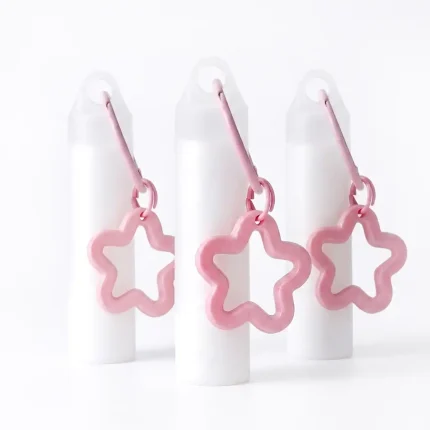 kemasan kosmetik BOTTLE LIP S217 varian warna putih dengan dekorasi pink