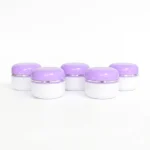 kemasan kosmetik POT 60GR PUTIH UNGU varian warna putih dengan cap ungu glossy