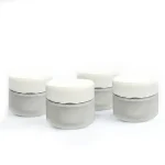 kemasan kosmetik POT FLOWER LIST SILVER varian warna transparan frosted dengan cap putih