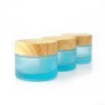 kemasan kosmetik POT KACA BLUE CAP KAYU varian warna biru frosted dengan cap motif kayu