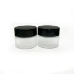 kemasan kosmetik POT KACA FROSTED 15 GRAM TUTUP HITAM varian warna bening frosted dengan cap hitam