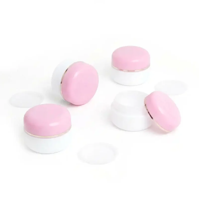 Home 29 kemasan POT PP 15GR PINK-PUTIH varian warna putih dengan aksen pink dan ring silver metalik premium